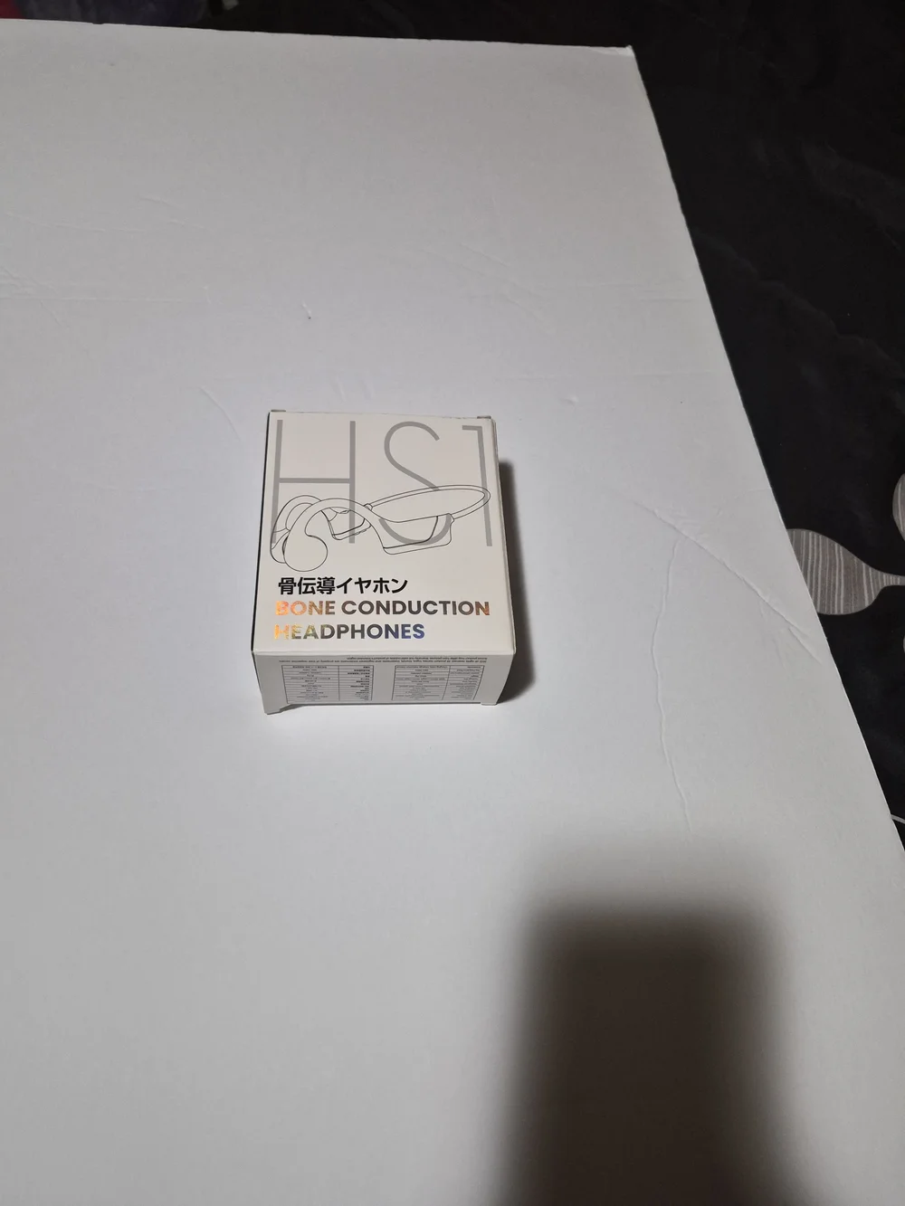 Bone Conduction Headphones in Black with Orange Earplugs